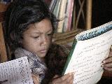 Girl Reading in Library