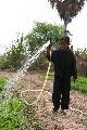 Girl With Irrigation Hose